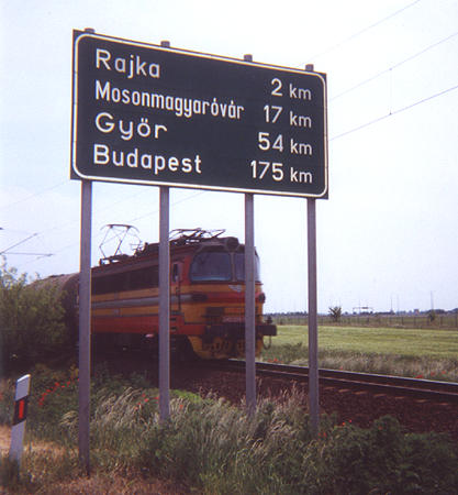 Road sign and train
